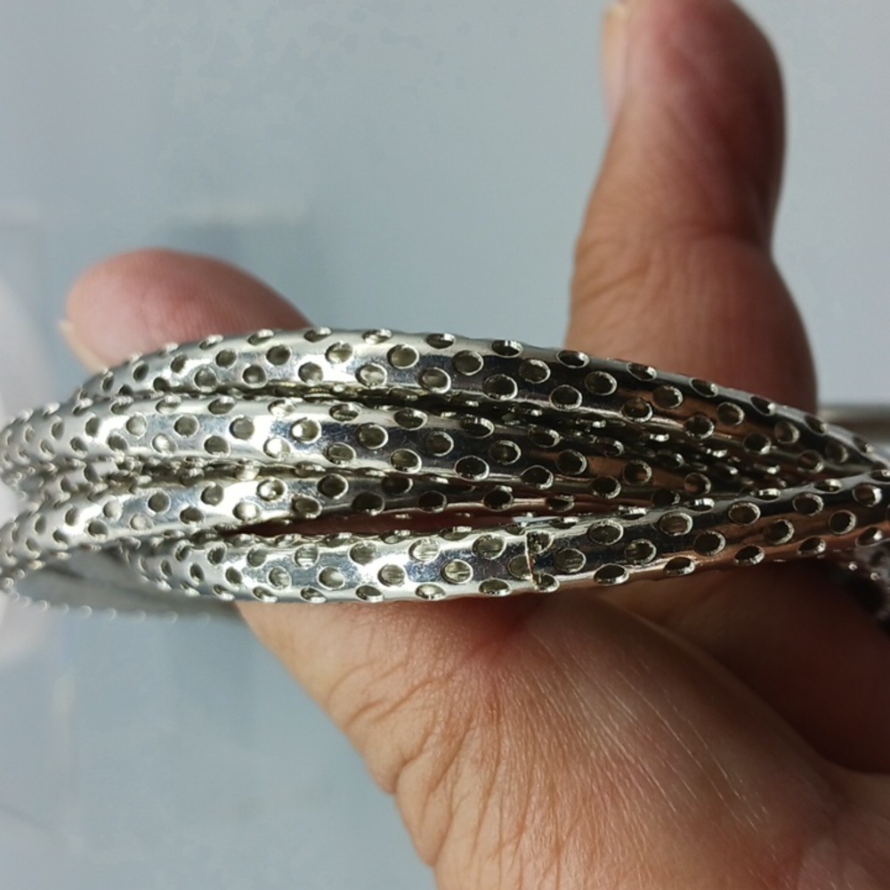 FIVE ATTACHED BANGLES